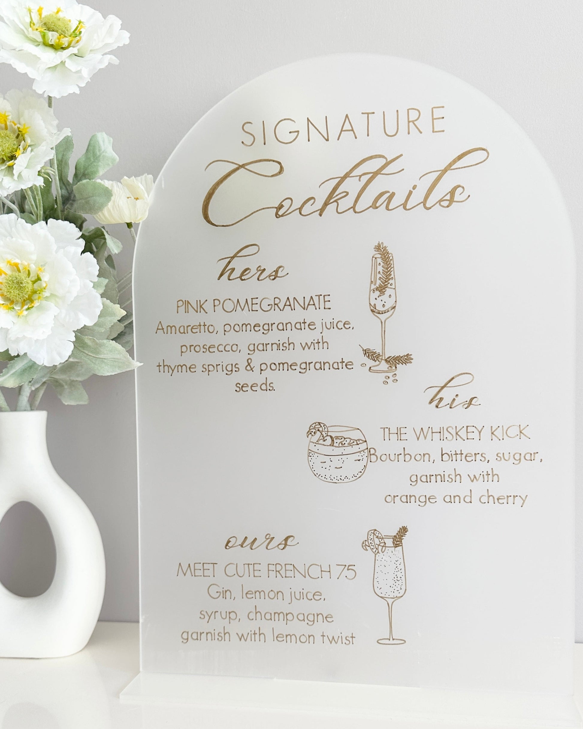 On a A3 price of frost acrylic with its own stand, this sign displays 3 signature cocktails, his, hers and ours with the names and ingredients, accompanied with illustrations of the drinks