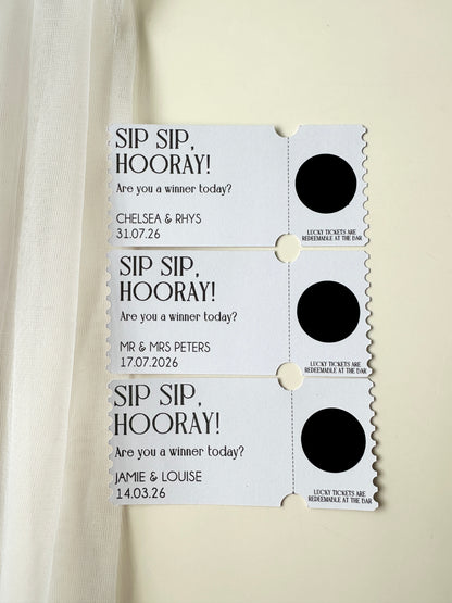 Set of three personalised tickets with black scratch ticket covering message with names and dates on a white background